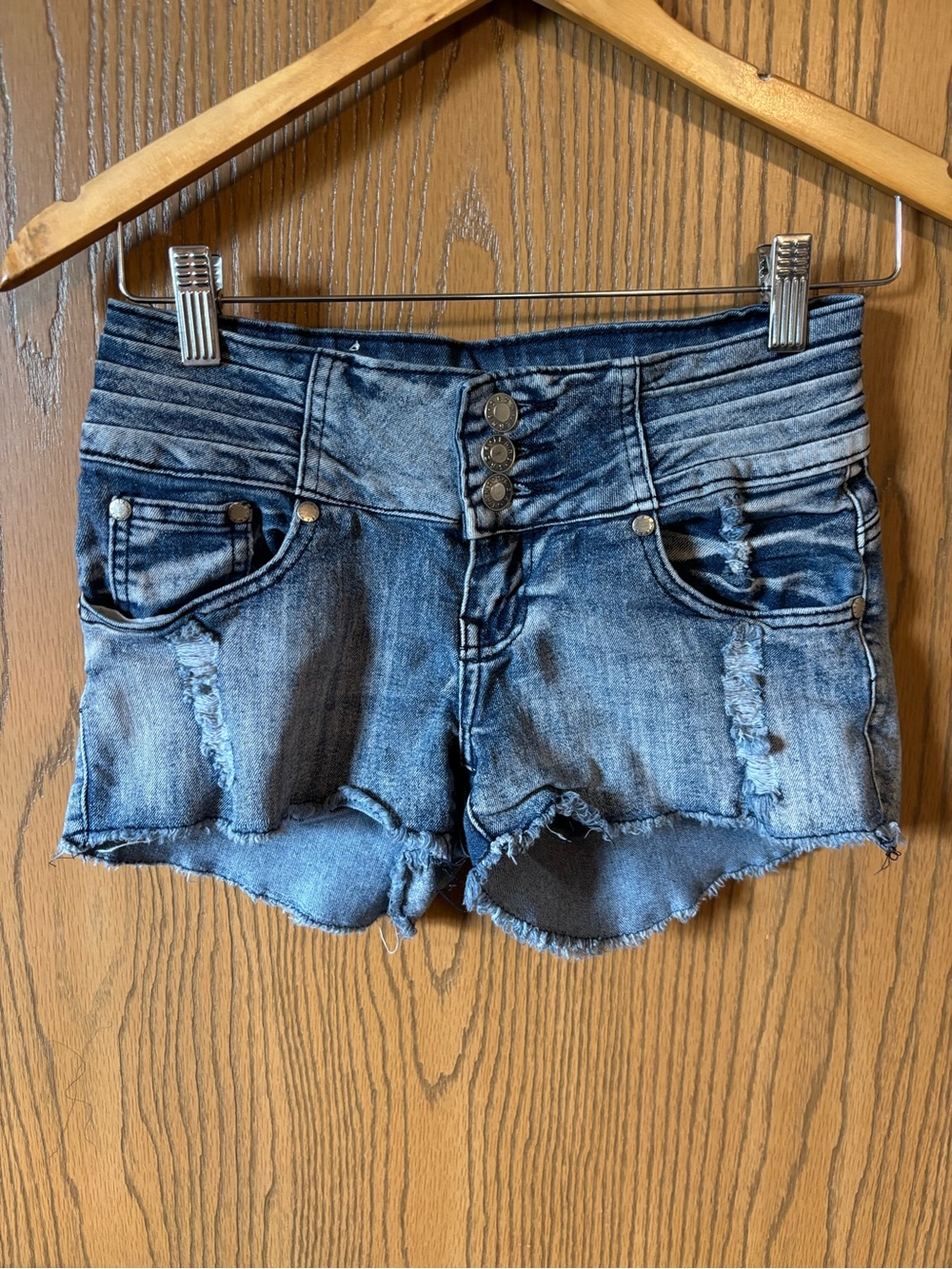 Saza High-Rise Distressed Denim Shorts in Faded Blue